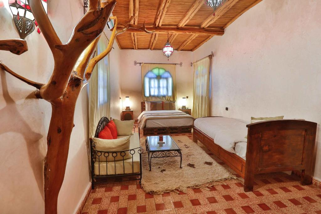 Postel nebo postele na pokoji v ubytování DAR ETTO Riad & Spa