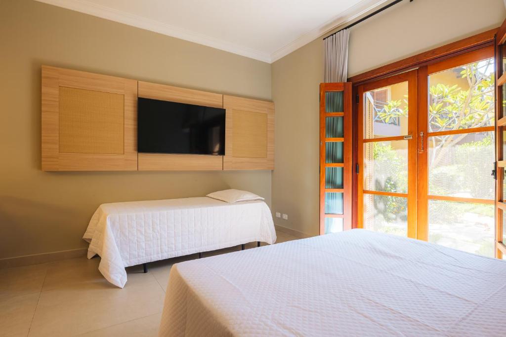 Postel nebo postele na pokoji v ubytování FLAT 3-107 - Iha Flat Hotel - Pereque - Ilhabela