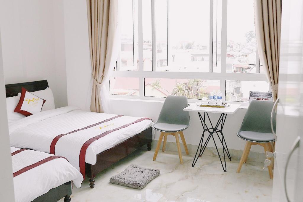 Giường trong phòng chung tại IvySnow Đà Lạt