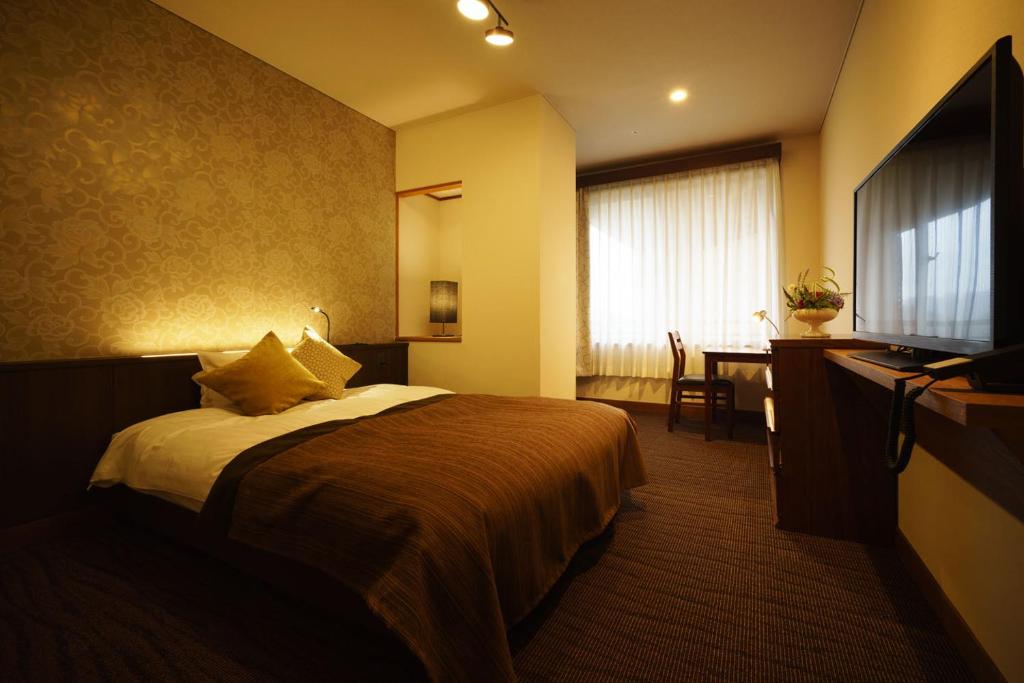 TV a/nebo společenská místnost v ubytování Kintarou Onsen Hotel