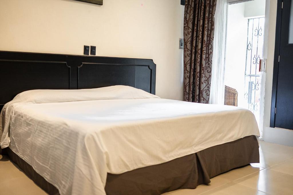 Postel nebo postele na pokoji v ubytování Hotel María de la Luz