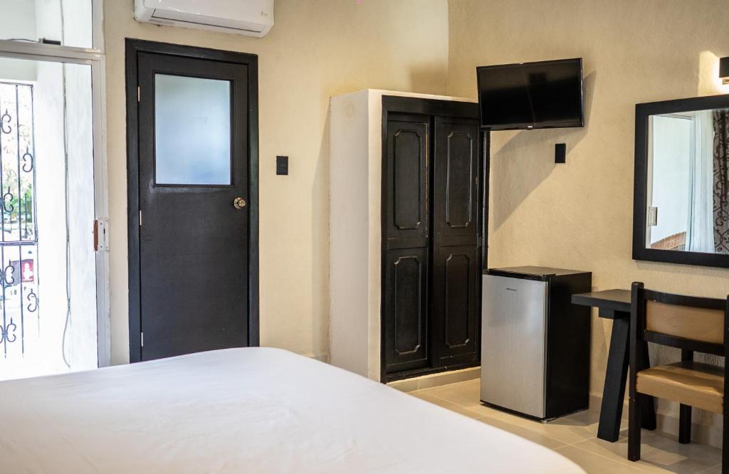 Postel nebo postele na pokoji v ubytování Hotel María de la Luz