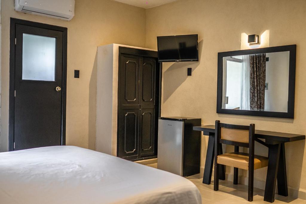 Postel nebo postele na pokoji v ubytování Hotel María de la Luz
