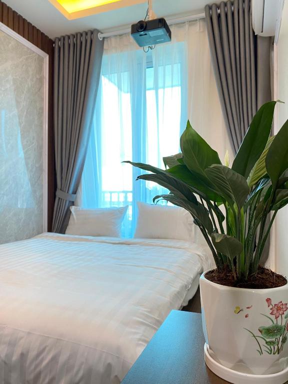 Postel nebo postele na pokoji v ubytování Hanoian Hotel