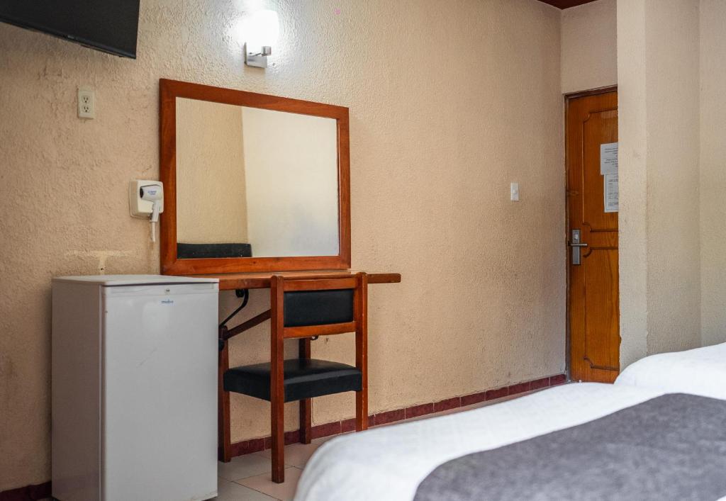Postel nebo postele na pokoji v ubytování Hotel María de la Luz