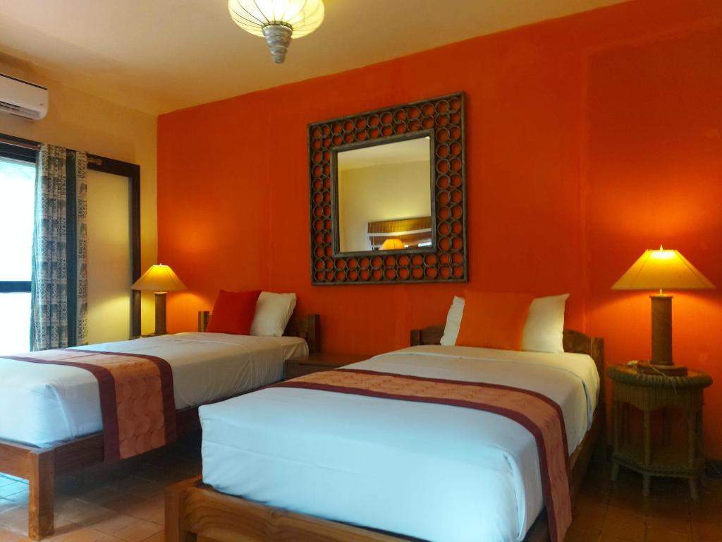 Postel nebo postele na pokoji v ubytování Mekong Villas