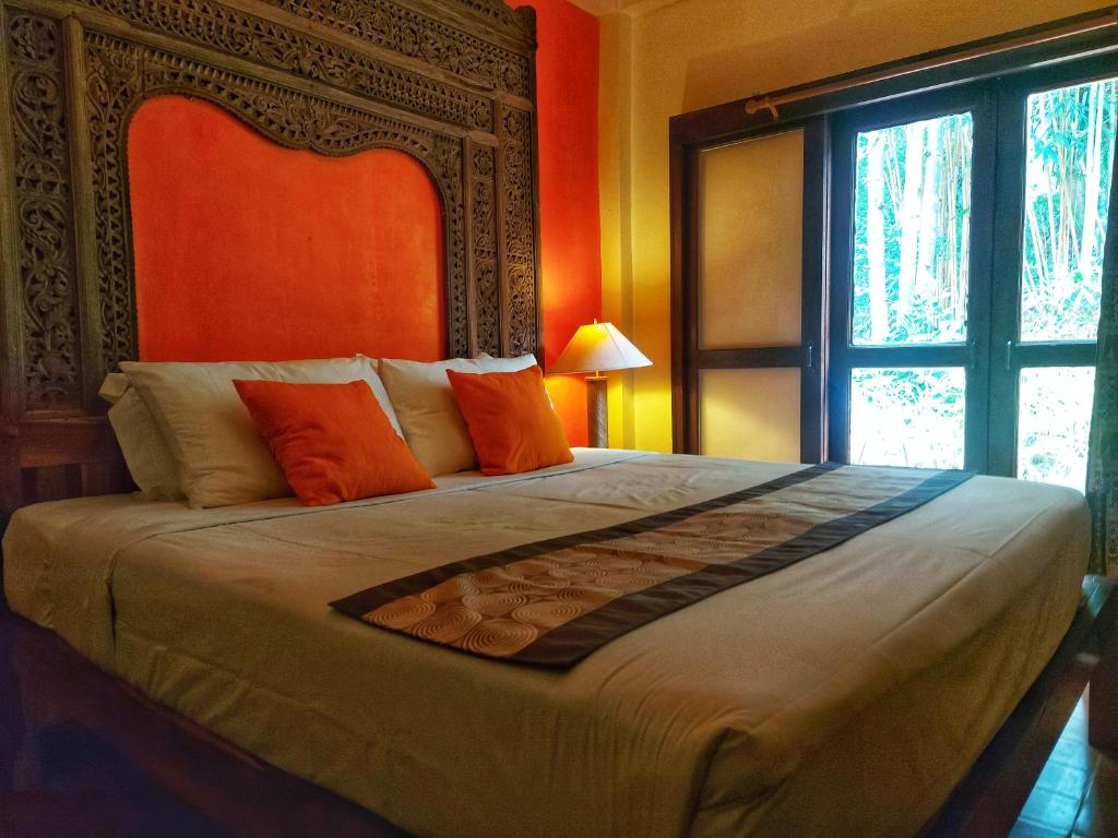 Postel nebo postele na pokoji v ubytování Mekong Villas