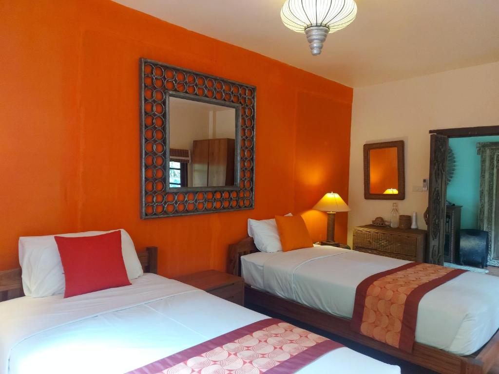 Postel nebo postele na pokoji v ubytování Mekong Villas