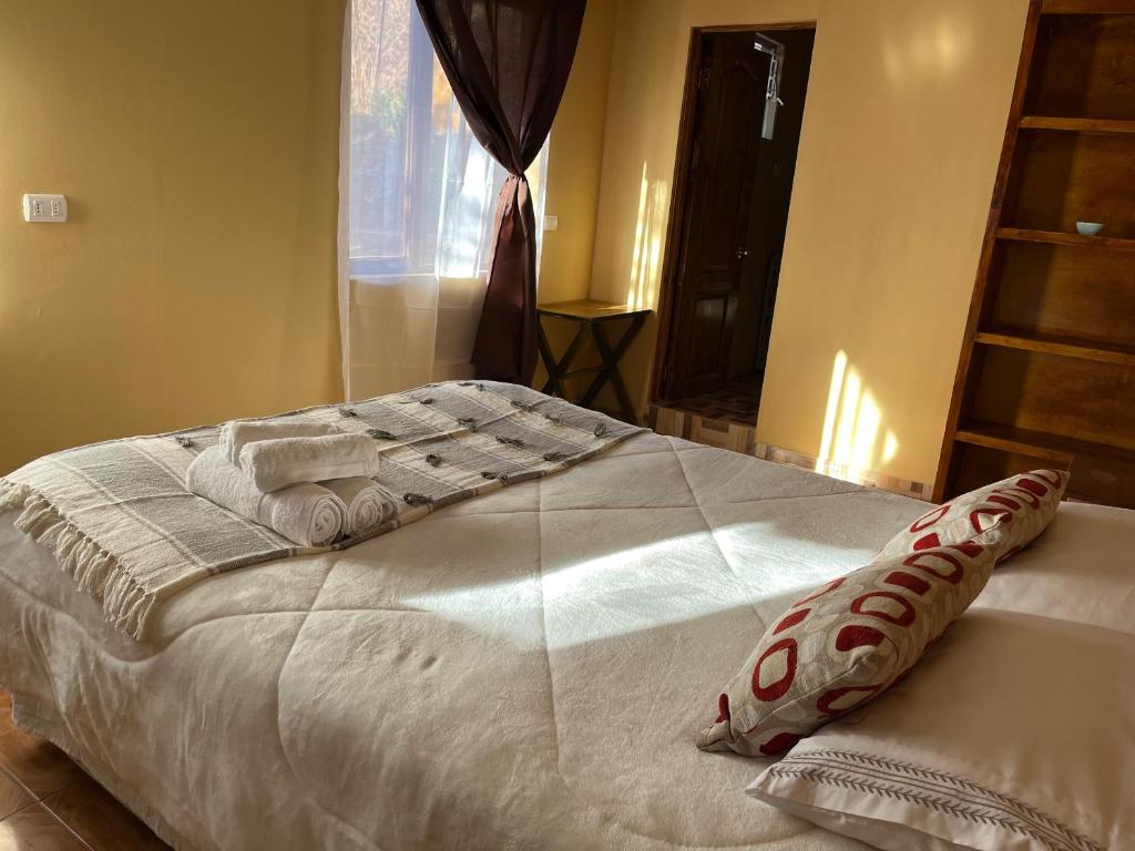 Voodi või voodid majutusasutuse Hostal Piedrita de Rio toas