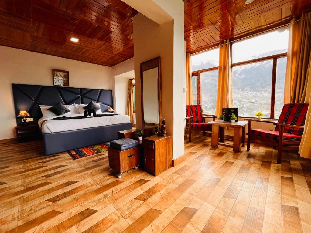 Posezení v ubytování Himalayan River Mountain View 2 Bedrooms Cottage, Manali