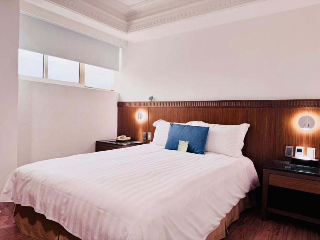 Postel nebo postele na pokoji v ubytování Hub Hotel Kaohsiung Cisian Branch