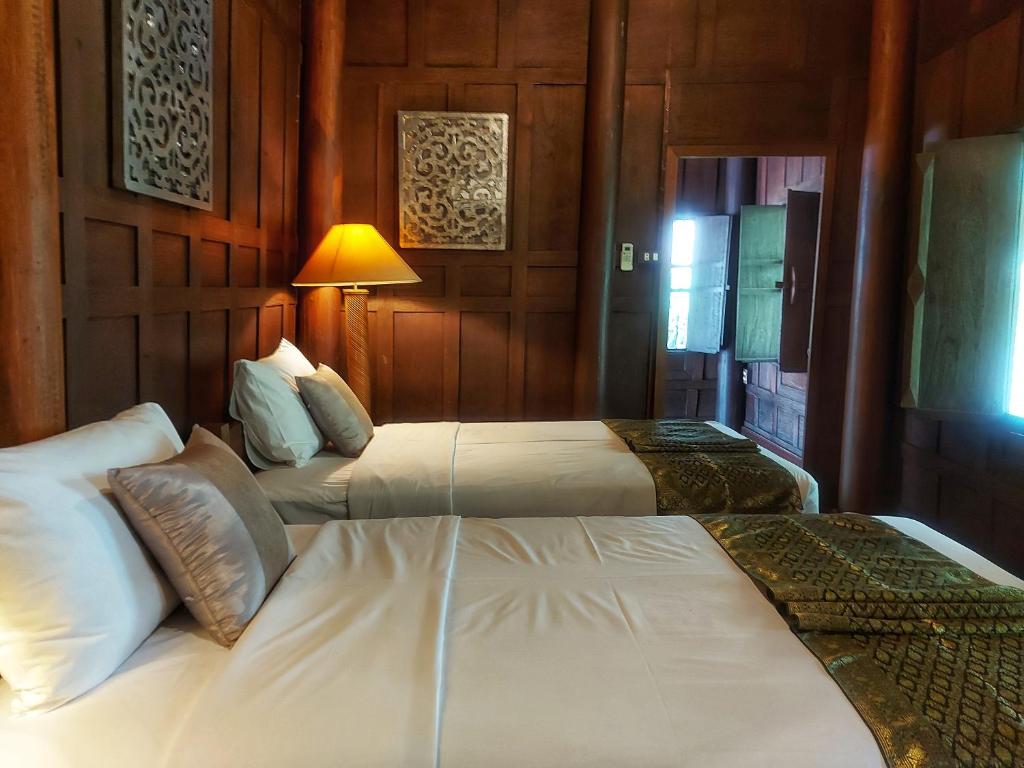 Postel nebo postele na pokoji v ubytování Mekong Villas
