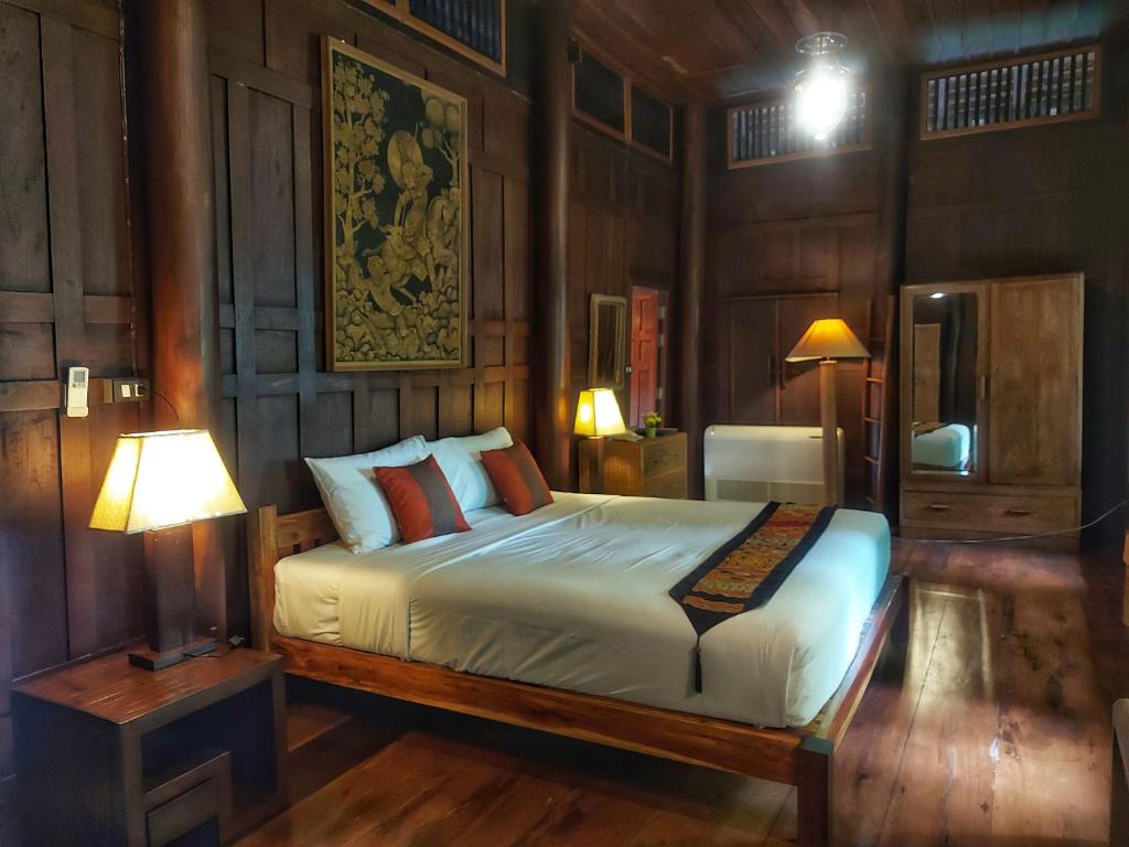 Postel nebo postele na pokoji v ubytování Mekong Villas