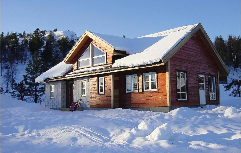 a house is covered in snow at 5 Bedroom Amazing Home In Kvinlog in Stakkeland