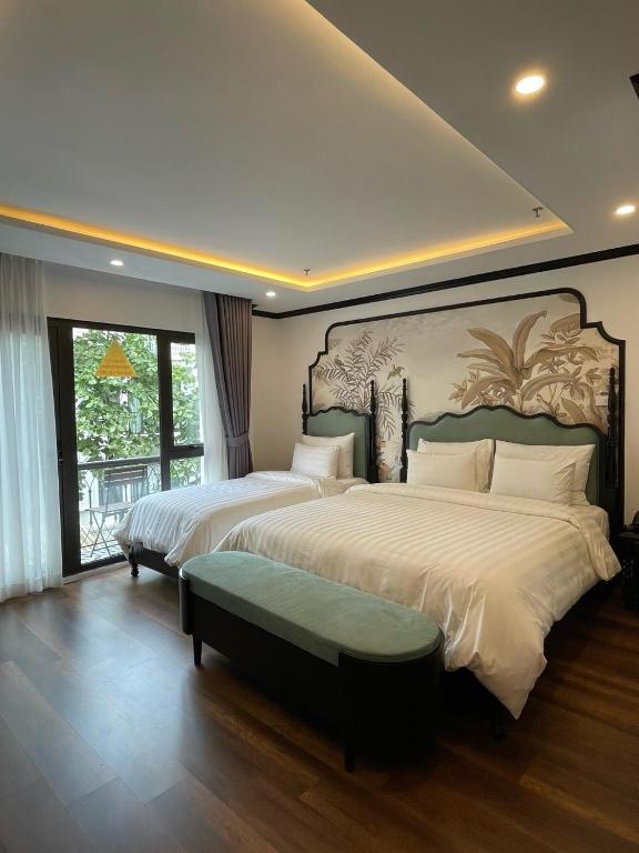 Postel nebo postele na pokoji v ubytování Aquarius Premium Hotel