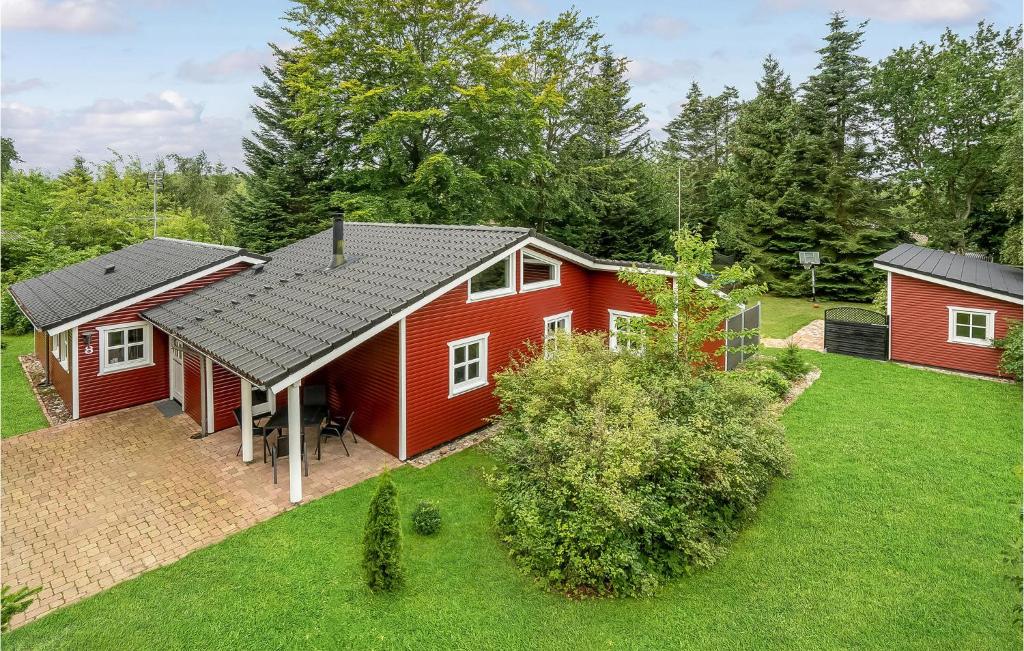 an aerial view of a red house with a yard at Holiday Home Agervej Glesborg Ii in Fjellerup