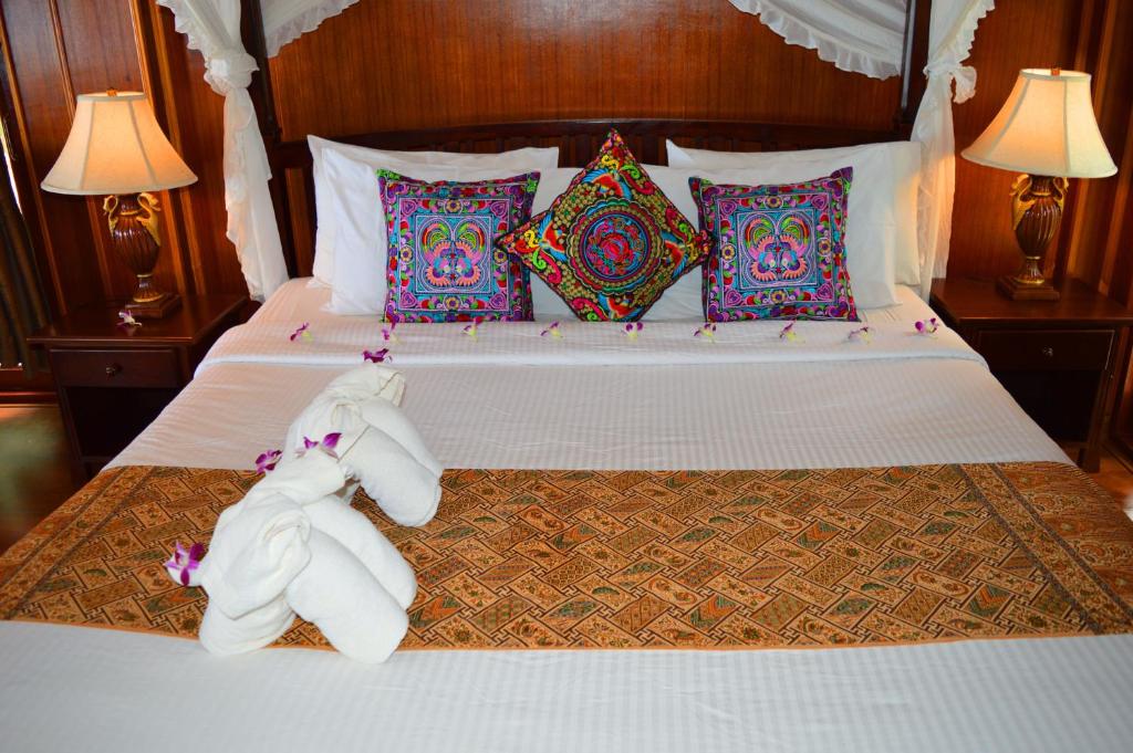 Postel nebo postele na pokoji v ubytování Sayang Beach Resort Koh Lanta