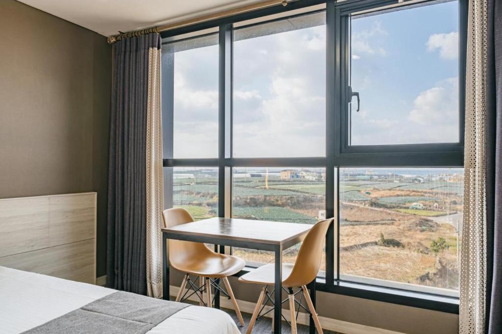Postel nebo postele na pokoji v ubytování Sky Hotel