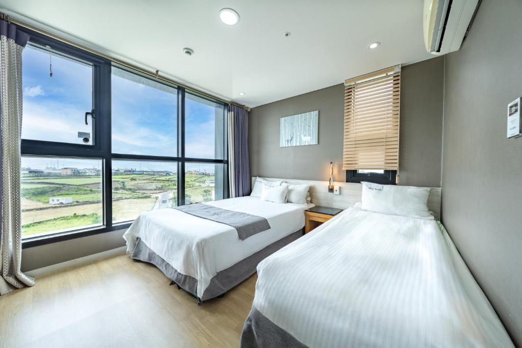 Postel nebo postele na pokoji v ubytování Sky Hotel
