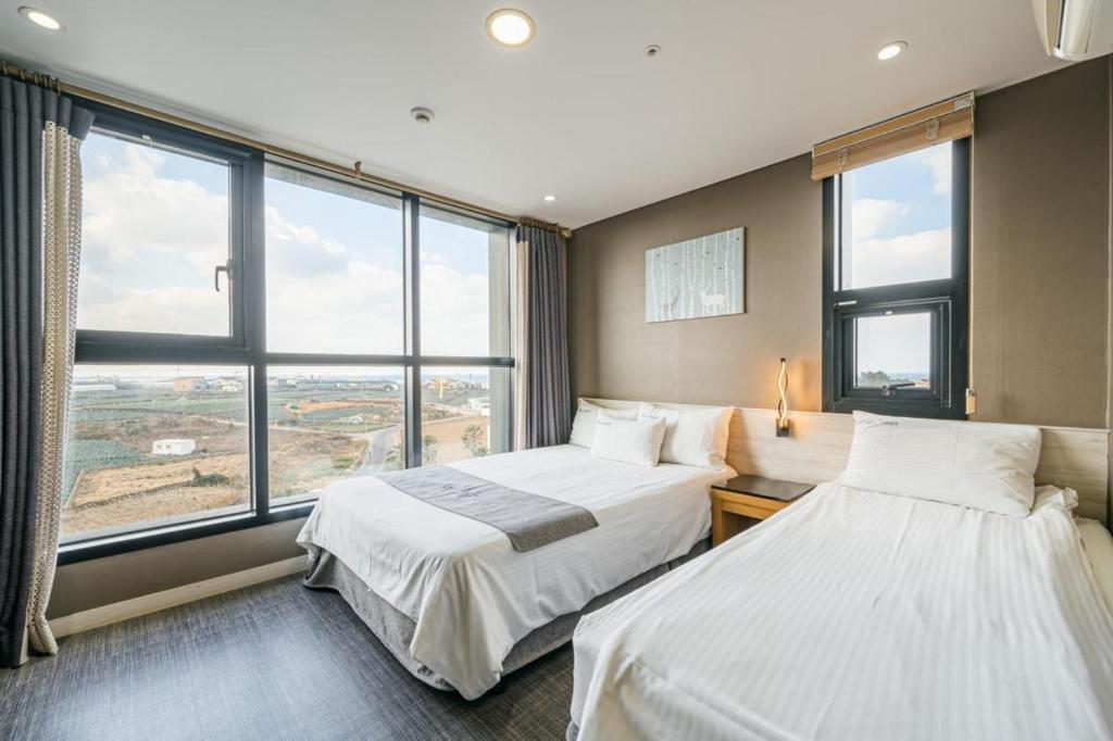 Postel nebo postele na pokoji v ubytování Sky Hotel