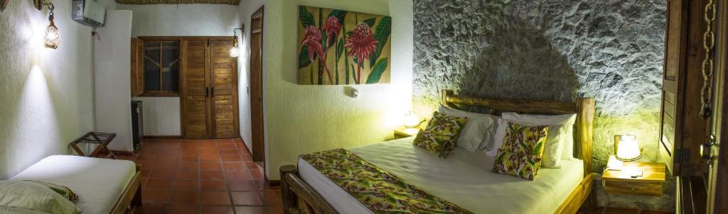 Postel nebo postele na pokoji v ubytování Hotel Brisas La Gaviota Mariquit-Tolima