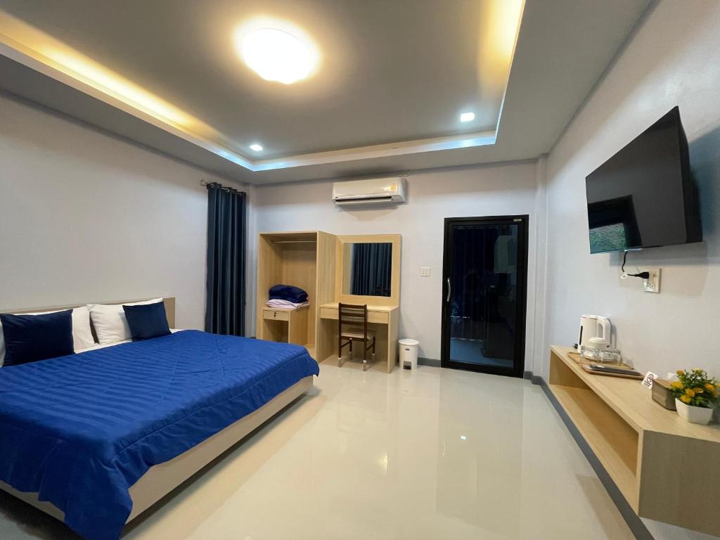 Postel nebo postele na pokoji v ubytování IBC Home ที่พักฮาลาล นครศรีธรรมราช