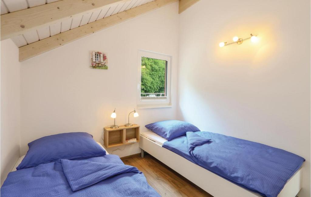 Postel nebo postele na pokoji v ubytování Ferienhausdorf Thale