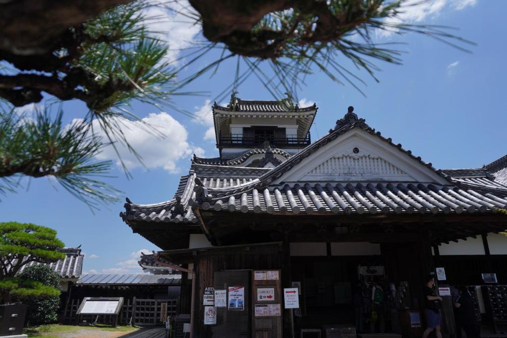 a building with a clock tower on top of it at Guest House BONITO in Kochi