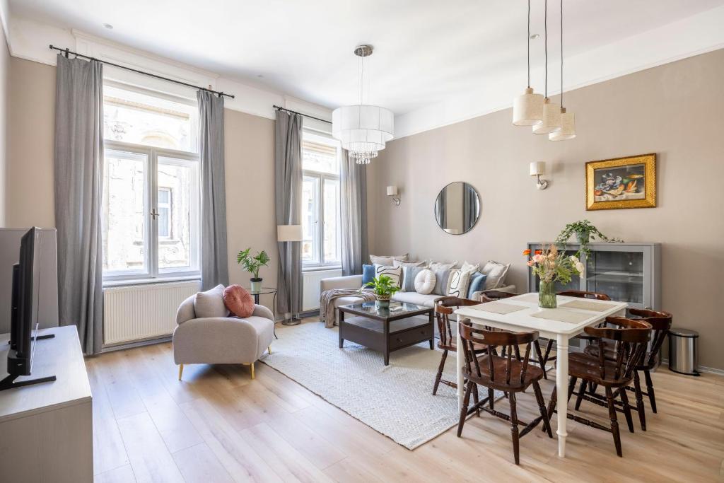 a living room with a couch and a table at Charming Central Dream Home & Retreat by Prestige Homes in Budapest