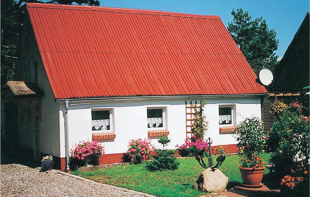 a small white house with an orange roof at Holiday Home Waldreihe Q in Saal