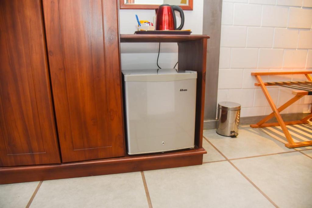 Kuchyň nebo kuchyňský kout v ubytování Royal Tusker Hotel