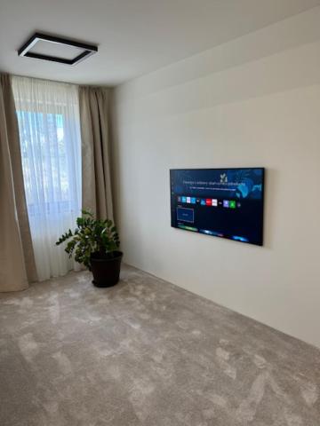 TV a/nebo společenská místnost v ubytování New York Pension