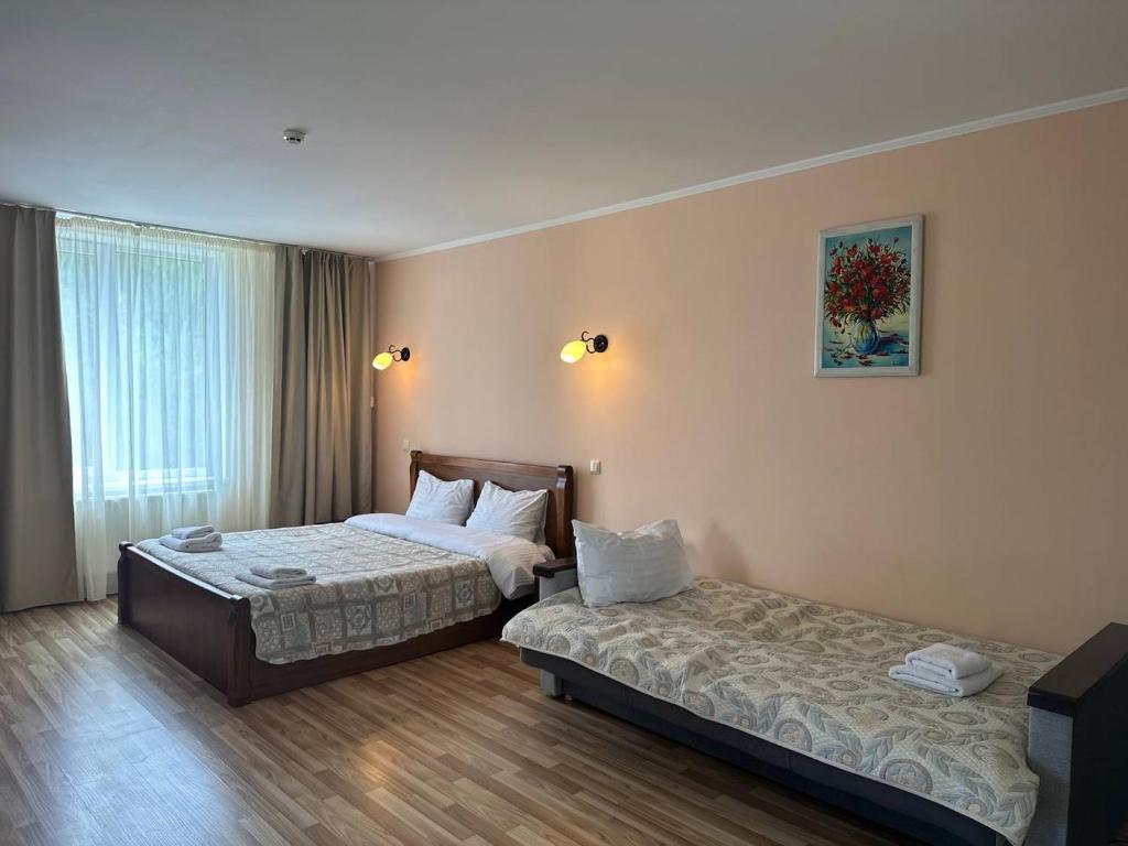 Postel nebo postele na pokoji v ubytování Panna Hotel