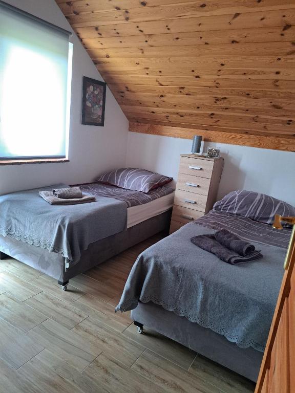 Posteľ alebo postele v izbe v ubytovaní Sunny Lake House Warmia i Mazury jezioro Dadaj