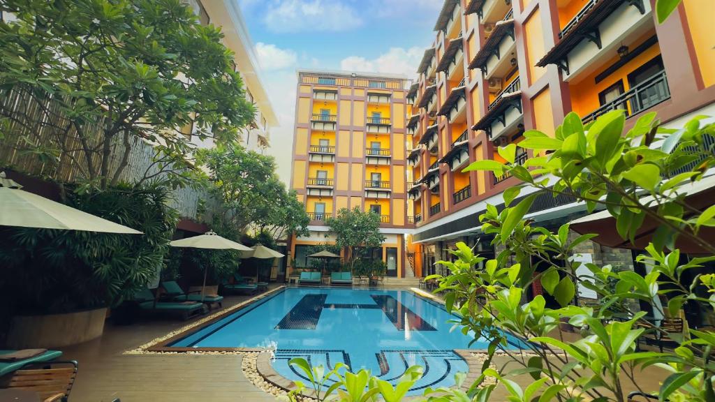 a swimming pool in the middle of a building at Sokchea Angkor Hotel in Siem Reap