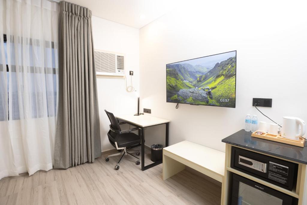TV a/nebo společenská místnost v ubytování Hamersons Hotel CDO