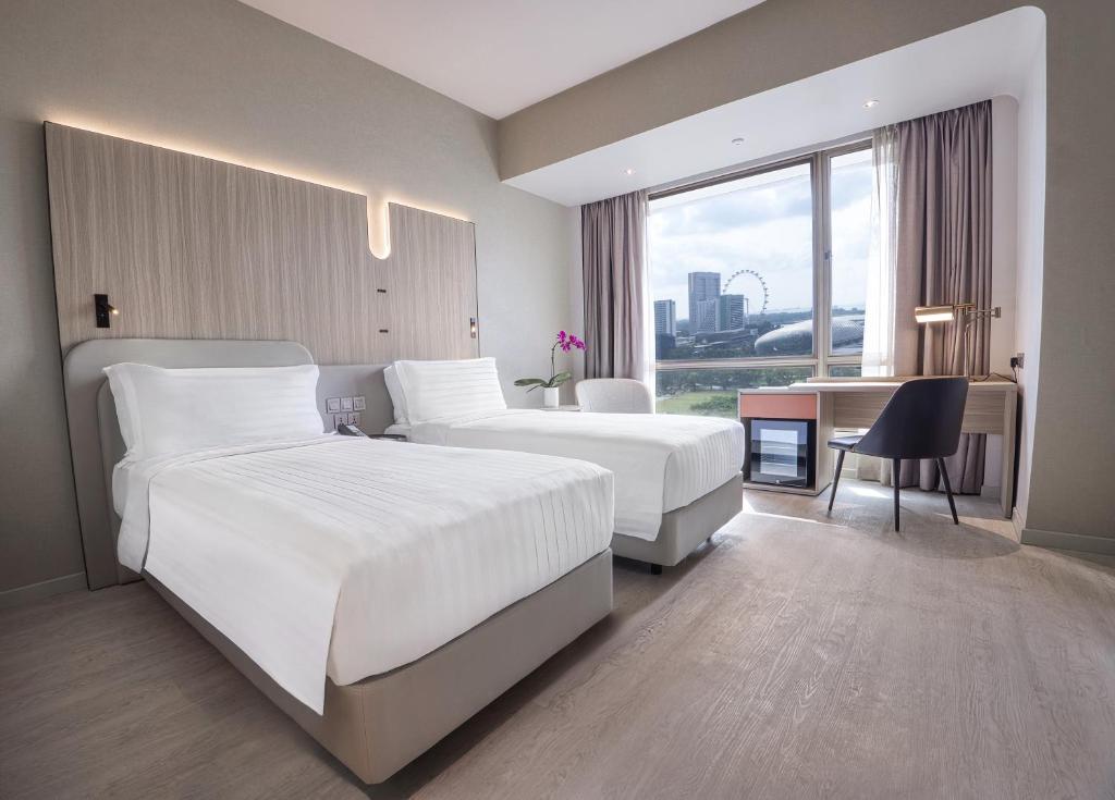 Postel nebo postele na pokoji v ubytování Wyndham Singapore Hotel