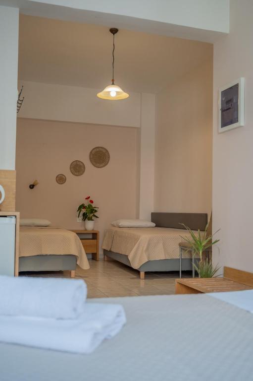 Postel nebo postele na pokoji v ubytování Theano Hotel
