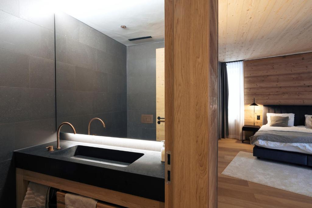 Postel nebo postele na pokoji v ubytování Andermatt Alpine Apartments