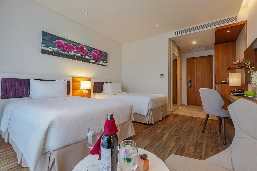 Giường trong phòng chung tại Vanda Hotel