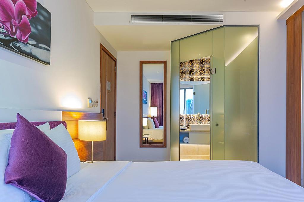 Postel nebo postele na pokoji v ubytování Vanda Hotel
