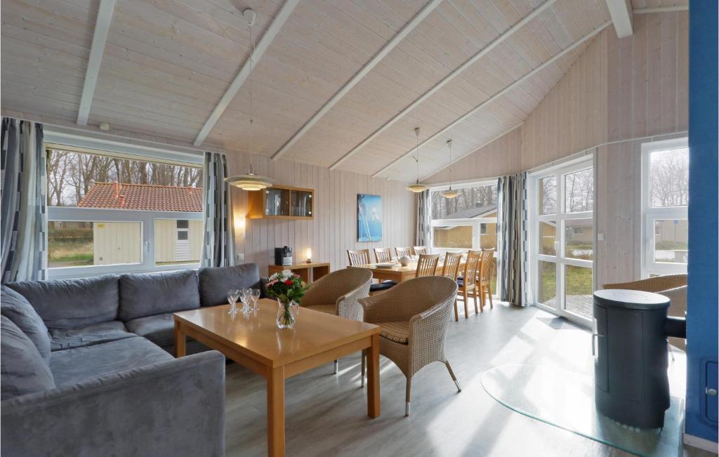 a living room with a couch and a table at Frische Brise 18 - Dorf 3 in Priwall