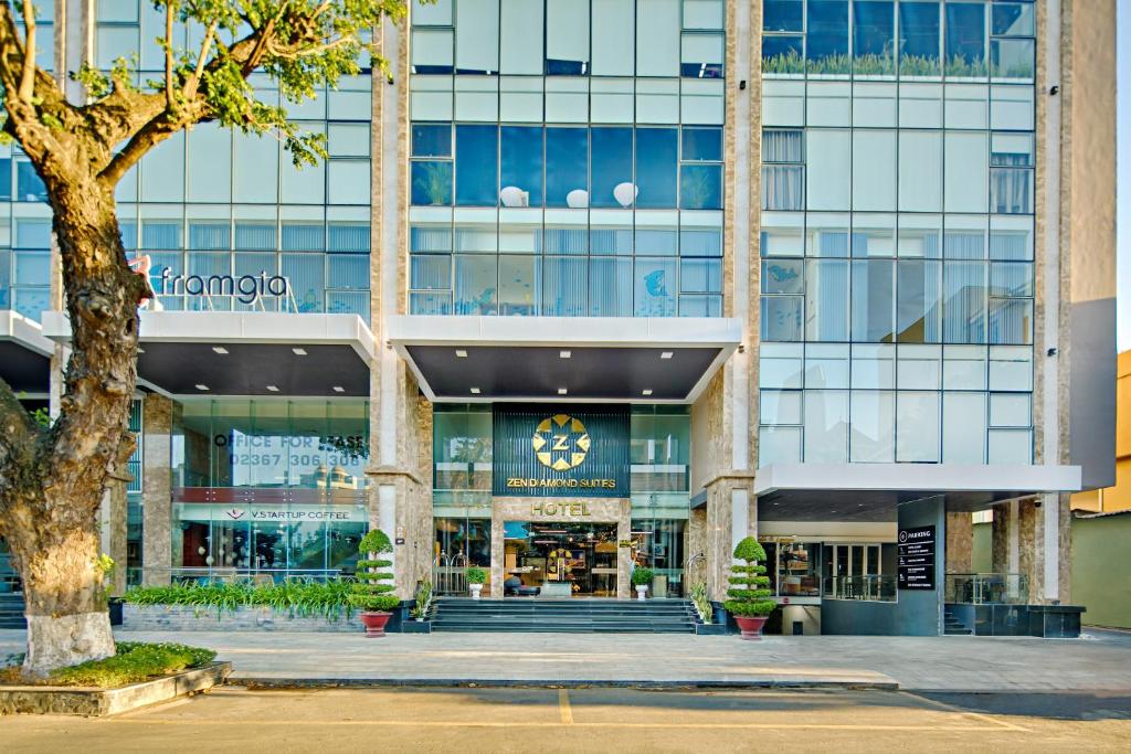 a building with a clock on the front of it at Abogo Apartment FHome Riverside in Da Nang