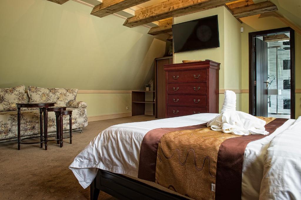 A bed or beds in a room at Mountain Resort Ždiar - River