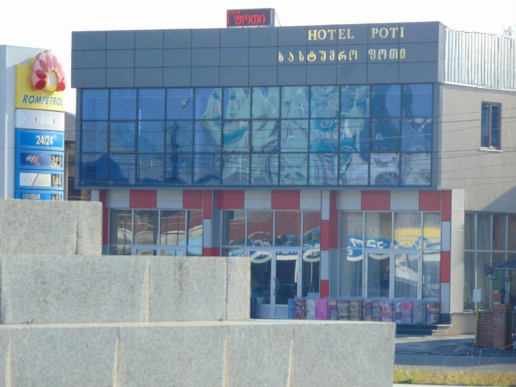 un edificio con un cartel encima en Poti Hotel, en Poti