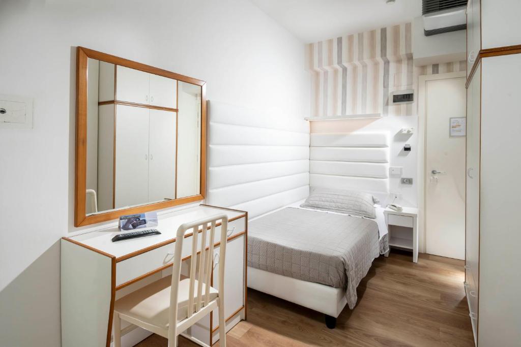 Postel nebo postele na pokoji v ubytování Hotel Albatros