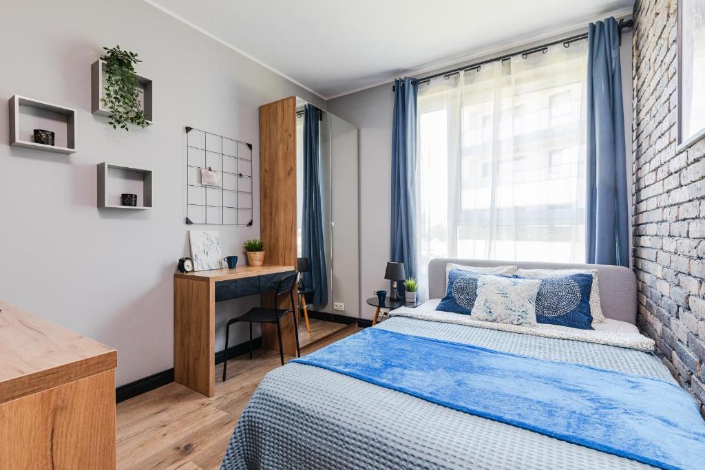 Posteľ alebo postele v izbe v ubytovaní SuperApart Przerwana 13 MiniStudio