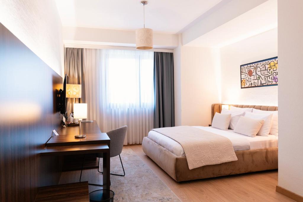 Postel nebo postele na pokoji v ubytování Hotel Sirius