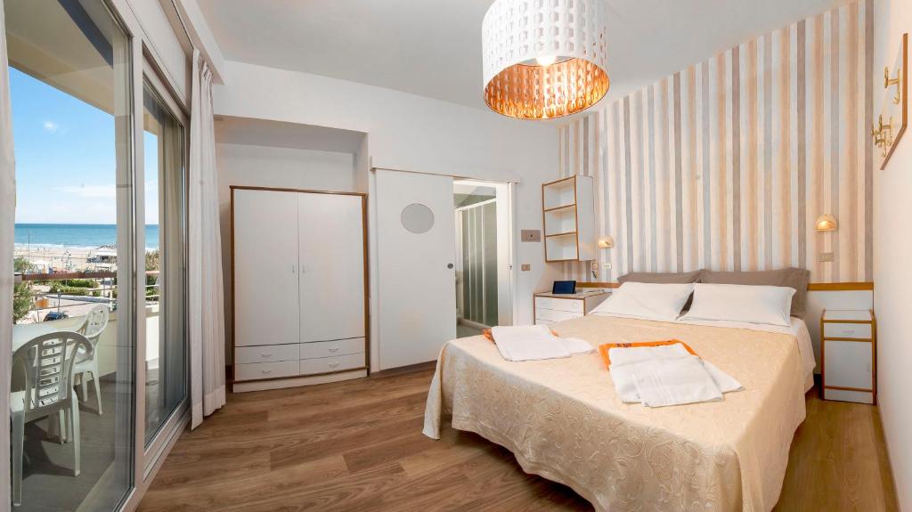 Postel nebo postele na pokoji v ubytování Hotel Albatros
