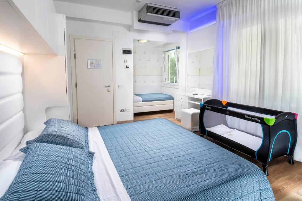 Postel nebo postele na pokoji v ubytování Hotel Albatros